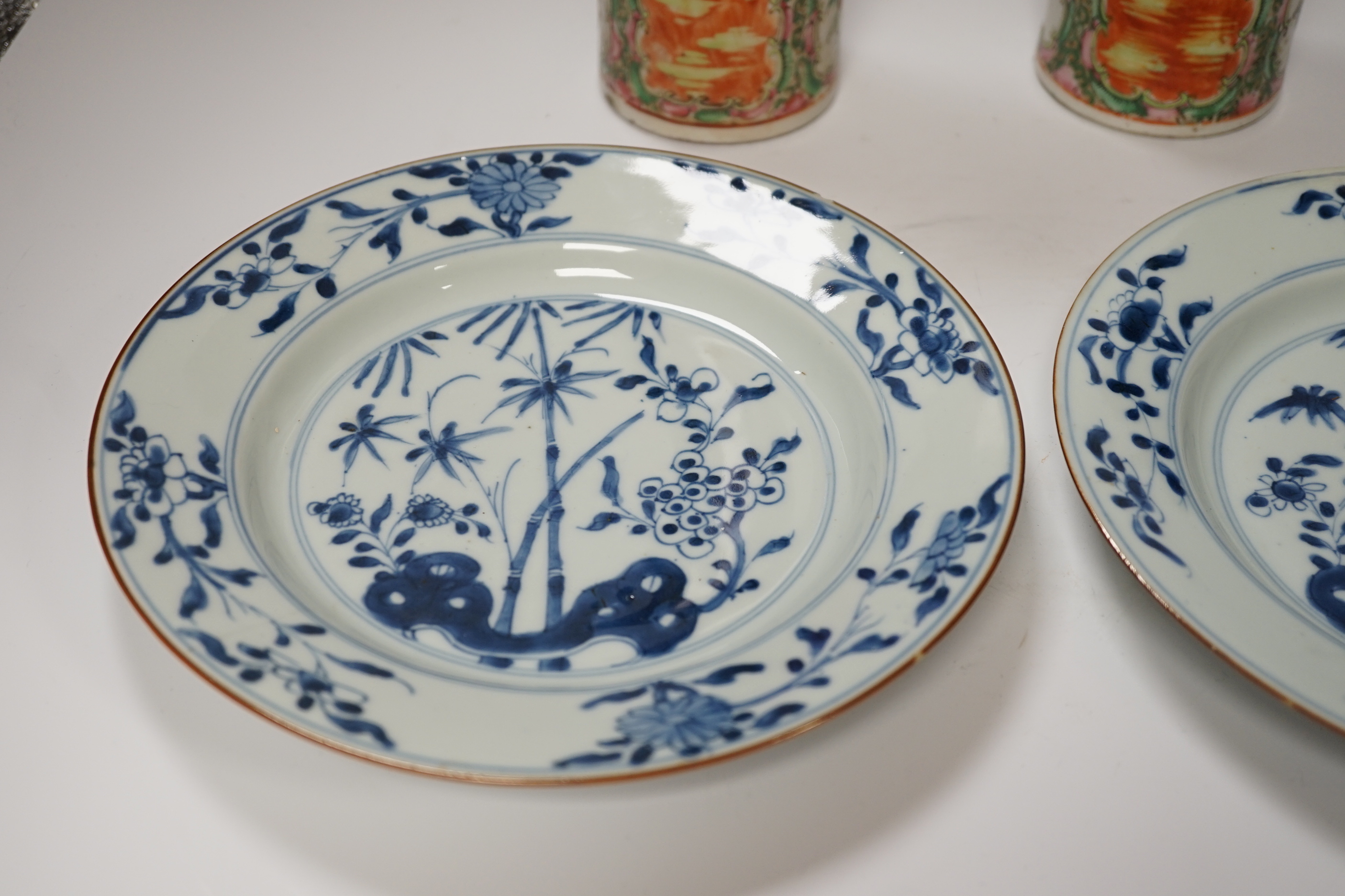 A pair of 19th century Chinese famille rose sleeve vases and a pair of 18th century Chinese blue and white plates, vases 26.5cm